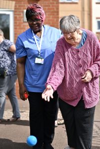Resident and carer outside