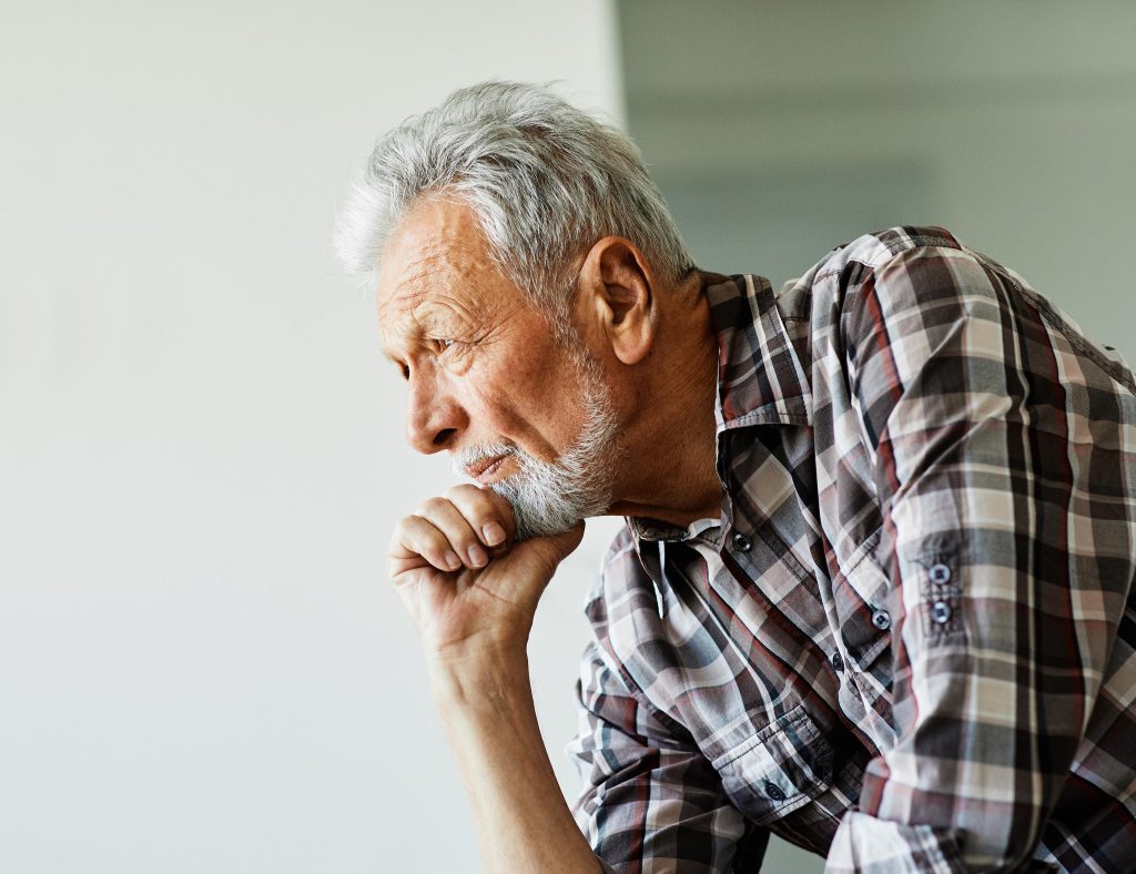 Man with hand on his chin