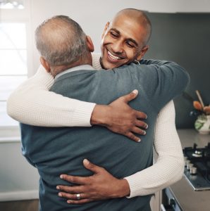 resident and loved one embracing each other